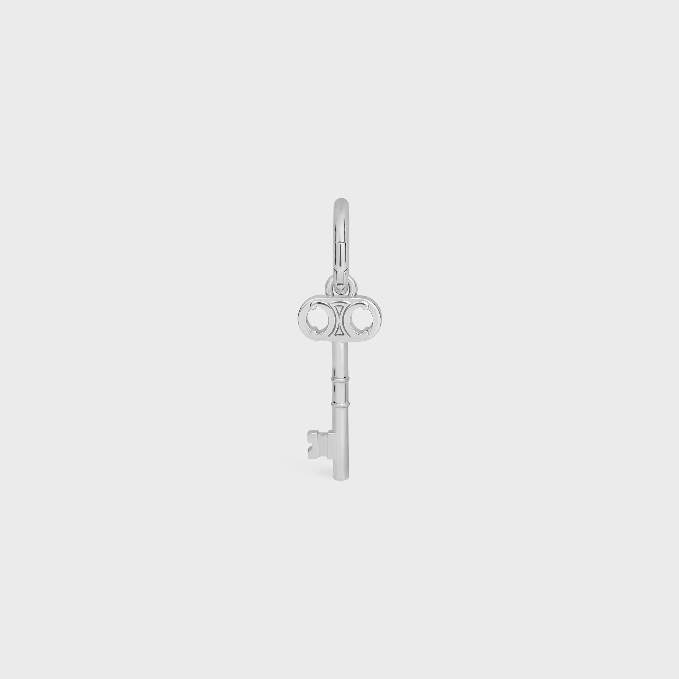 CHARM TRIOMPHE CHAVE EM LATÃO COM ACABAMENTO RODIADO